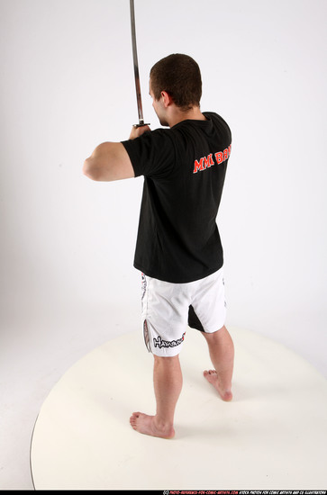 Man Adult Athletic White Fighting with sword Standing poses Sportswear