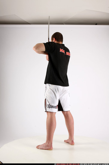 Man Adult Athletic White Fighting with sword Standing poses Sportswear