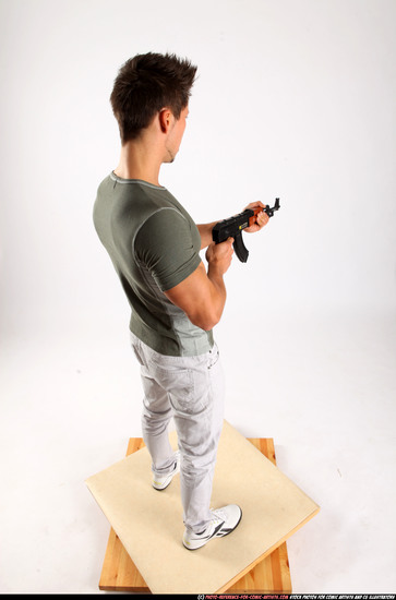 Man Adult Muscular White Fighting with submachine gun Standing poses Casual