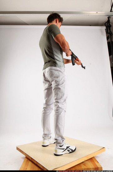 Man Adult Muscular White Fighting with submachine gun Standing poses Casual