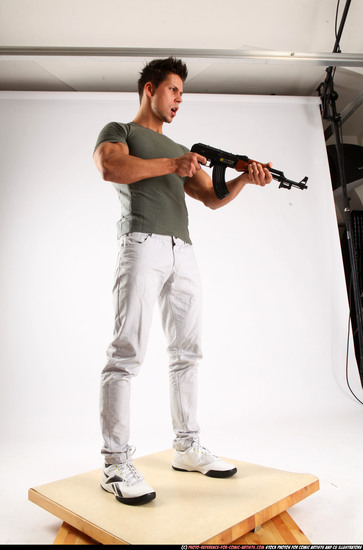 Man Adult Muscular White Fighting with submachine gun Standing poses Casual