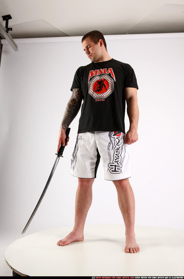 Man Adult Athletic White Fighting with sword Standing poses Sportswear