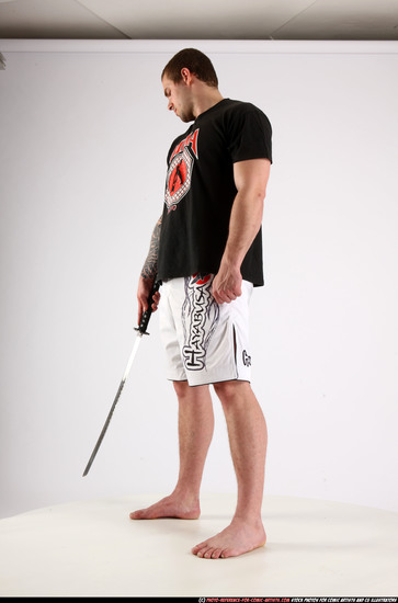 Man Adult Athletic White Fighting with sword Standing poses Sportswear