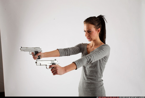 Woman Adult Athletic White Fighting with gun Standing poses Casual