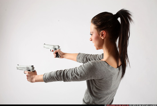 Woman Adult Athletic White Fighting with gun Standing poses Casual