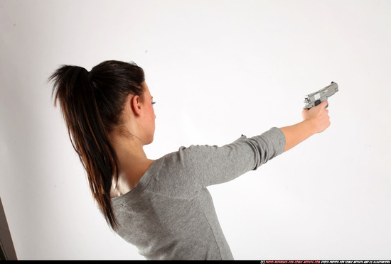 Woman Adult Athletic White Fighting with gun Standing poses Casual