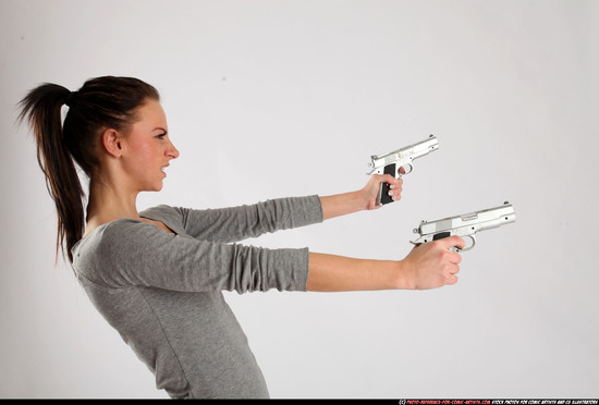 Woman Adult Athletic White Fighting with gun Standing poses Casual