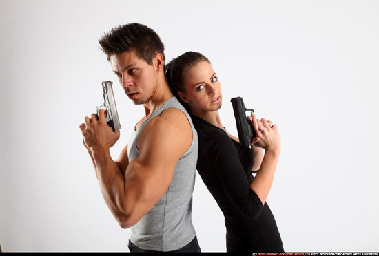 Man & Woman Adult Athletic White Fighting with gun Standing poses Casual