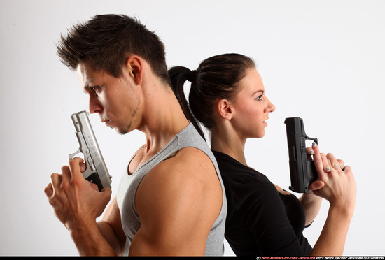 Man & Woman Adult Athletic White Fighting with gun Standing poses Casual