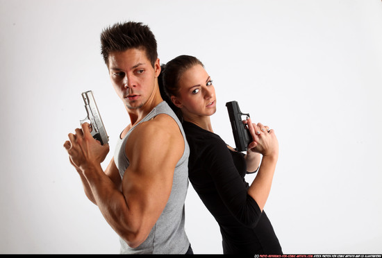 Man & Woman Adult Athletic White Fighting with gun Standing poses Casual