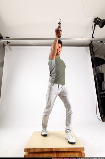 Man Adult Muscular White Fighting with gun Standing poses Casual