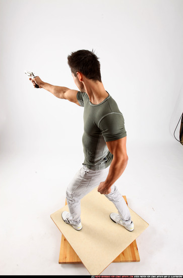 Man Adult Muscular White Fighting with gun Standing poses Casual