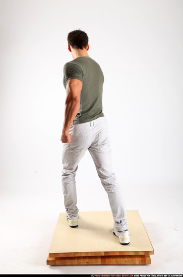 Man Adult Muscular White Fighting with gun Standing poses Casual