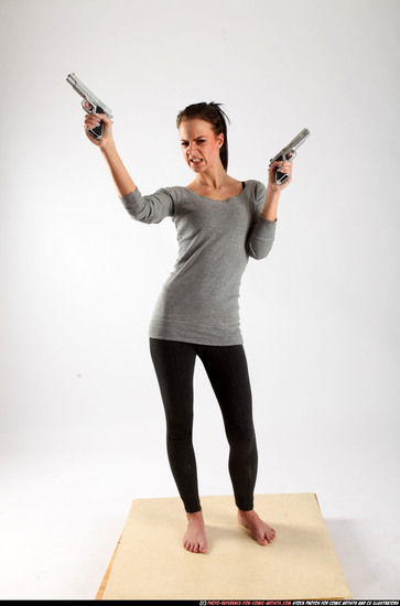 Woman Adult Athletic White Fighting with gun Standing poses Casual