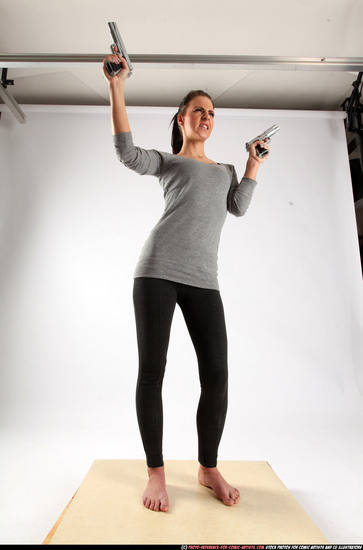 Woman Adult Athletic White Fighting with gun Standing poses Casual