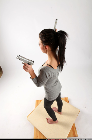 Woman Adult Athletic White Fighting with gun Standing poses Casual