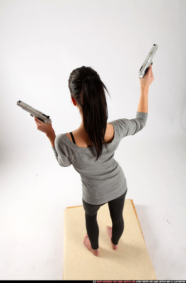 Woman Adult Athletic White Fighting with gun Standing poses Casual