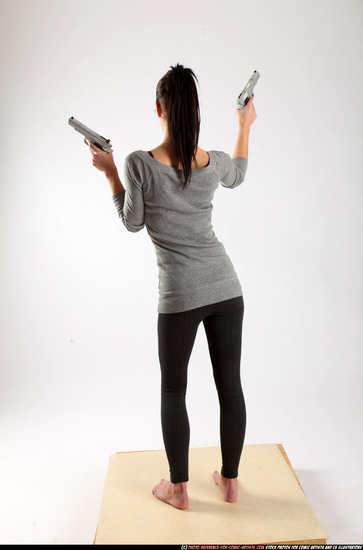 Woman Adult Athletic White Fighting with gun Standing poses Casual