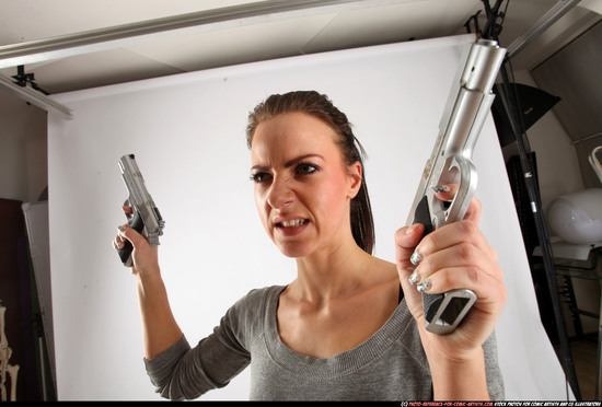 Woman Adult Athletic White Fighting with gun Standing poses Casual