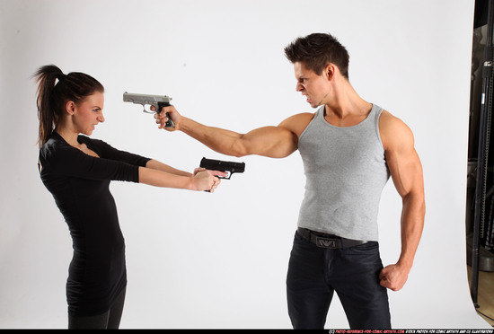 Man & Woman Adult Athletic White Fighting with gun Standing poses Casual