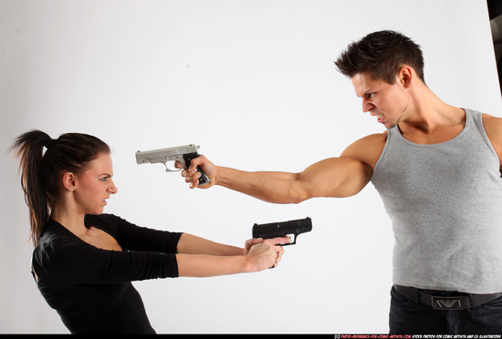 Man & Woman Adult Athletic White Fighting with gun Standing poses Casual