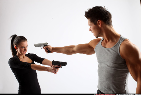 Man & Woman Adult Athletic White Fighting with gun Standing poses Casual