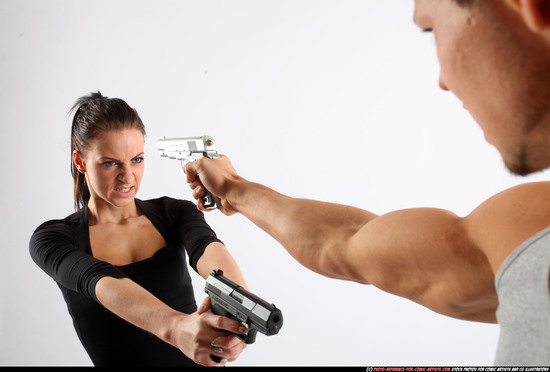 Man & Woman Adult Athletic White Fighting with gun Standing poses Casual