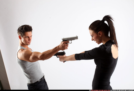 Man & Woman Adult Athletic White Fighting with gun Standing poses Casual