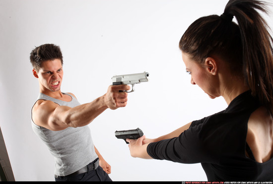 Man & Woman Adult Athletic White Fighting with gun Standing poses Casual