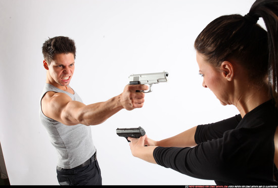 Man & Woman Adult Athletic White Fighting with gun Standing poses Casual