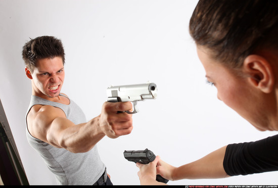 Man & Woman Adult Athletic White Fighting with gun Standing poses Casual