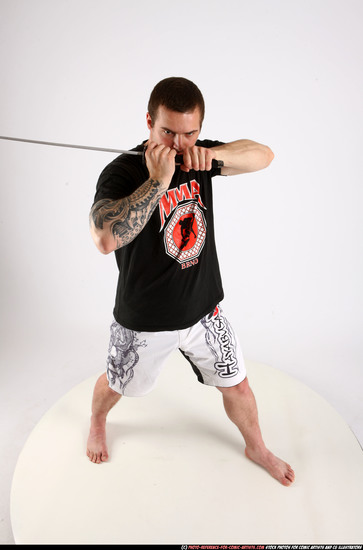 Man Adult Athletic White Fighting with sword Standing poses Sportswear