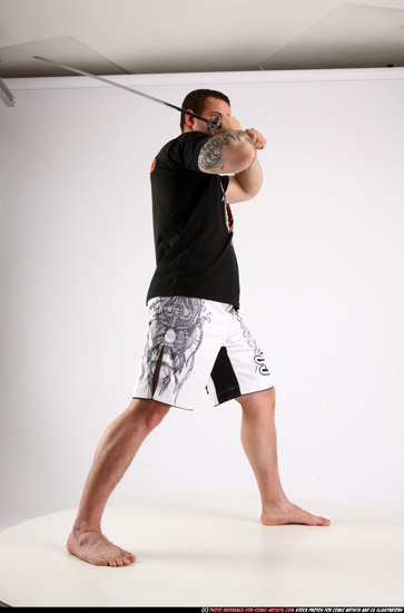 Man Adult Athletic White Fighting with sword Standing poses Sportswear