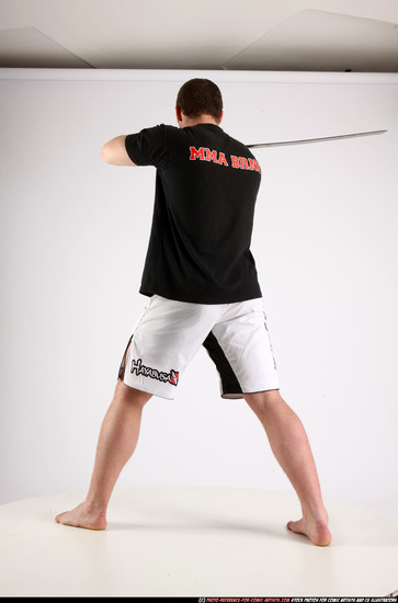 Man Adult Athletic White Fighting with sword Standing poses Sportswear