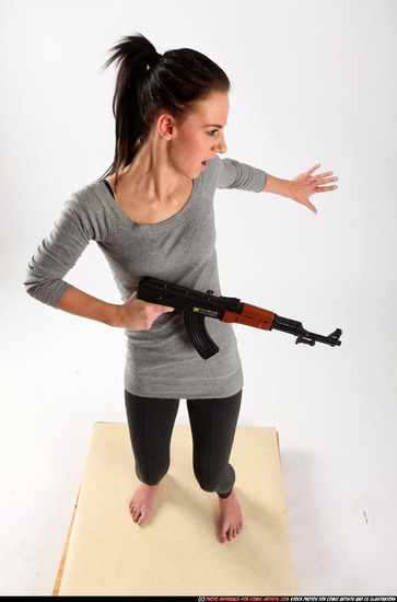 Woman Adult Athletic White Fighting with submachine gun Standing poses Casual