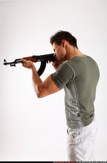 Man Adult Athletic White Fighting with submachine gun Standing poses Casual