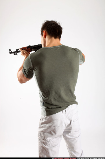 Man Adult Athletic White Fighting with submachine gun Standing poses Casual