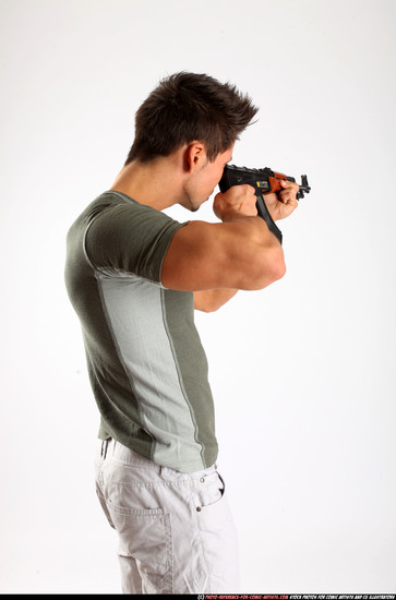 Man Adult Athletic White Fighting with submachine gun Standing poses Casual