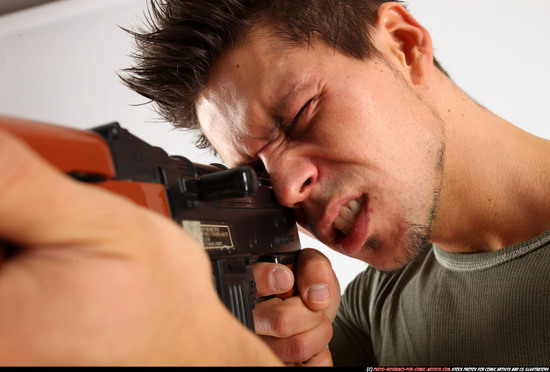 Man Adult Athletic White Fighting with submachine gun Standing poses Casual