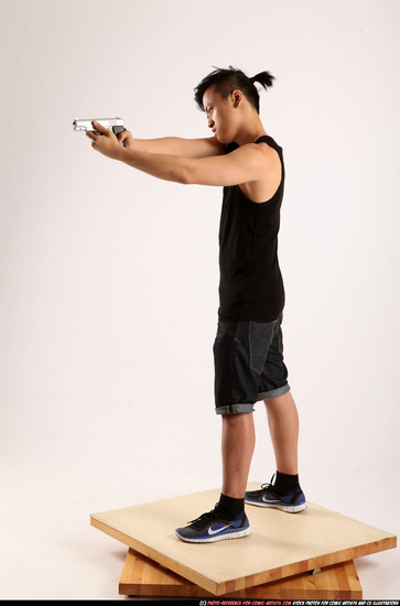 Man Young Athletic Fighting with gun Standing poses Casual Asian