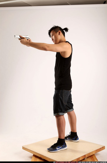 Man Young Athletic Fighting with gun Standing poses Casual Asian