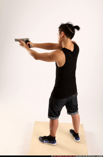 Man Young Athletic Fighting with gun Standing poses Casual Asian