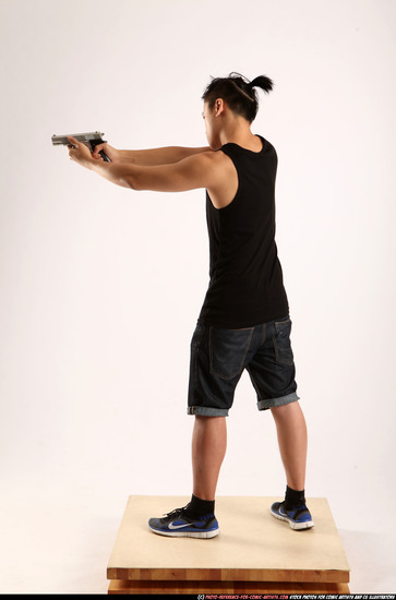 Man Young Athletic Fighting with gun Standing poses Casual Asian