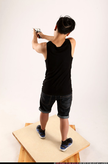 Man Young Athletic Fighting with gun Standing poses Casual Asian