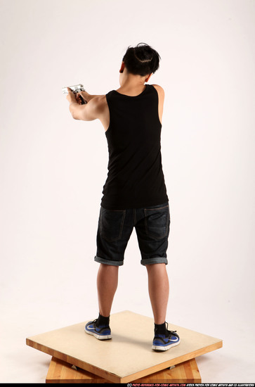 Man Young Athletic Fighting with gun Standing poses Casual Asian