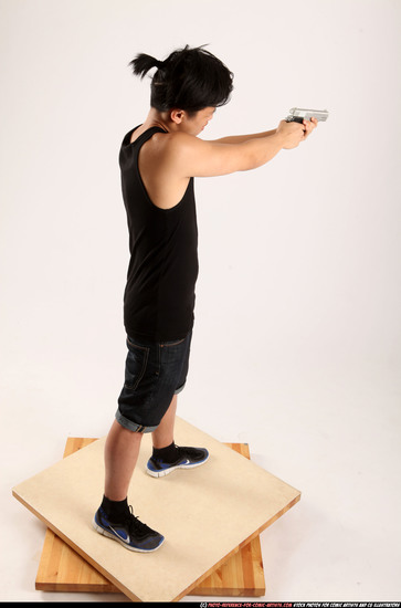 Man Young Athletic Fighting with gun Standing poses Casual Asian