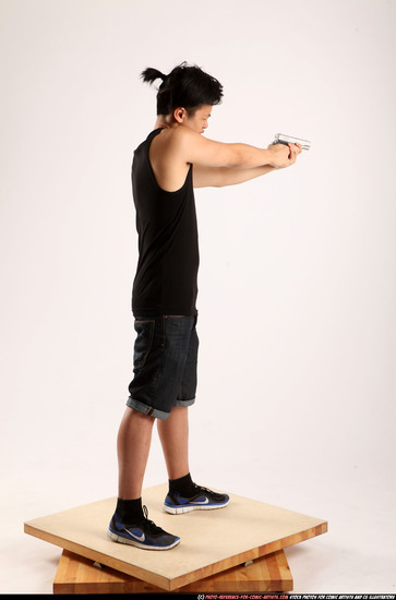 Man Young Athletic Fighting with gun Standing poses Casual Asian