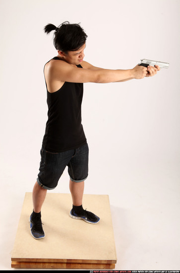 Man Young Athletic Fighting with gun Standing poses Casual Asian