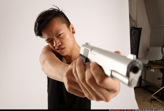 Man Young Athletic Fighting with gun Standing poses Casual Asian