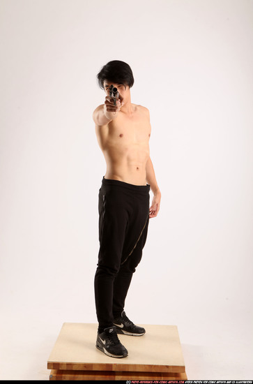 Man Young Athletic Fighting with rifle Standing poses Pants Asian